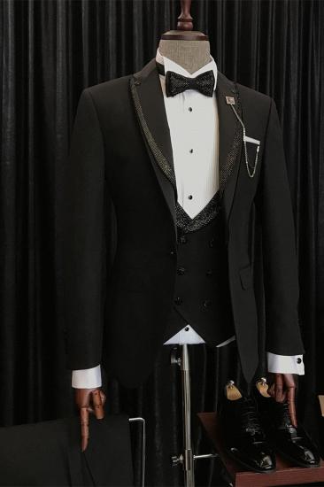 Benjamin's specially designed black wedding suit with shiny black pointed lapels